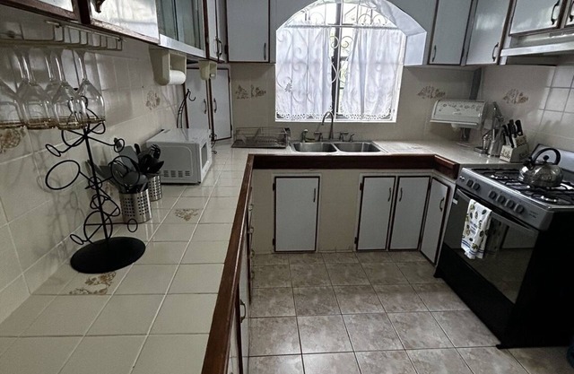 Spacious 4-bedroom residence featuring a ground floor apartment.