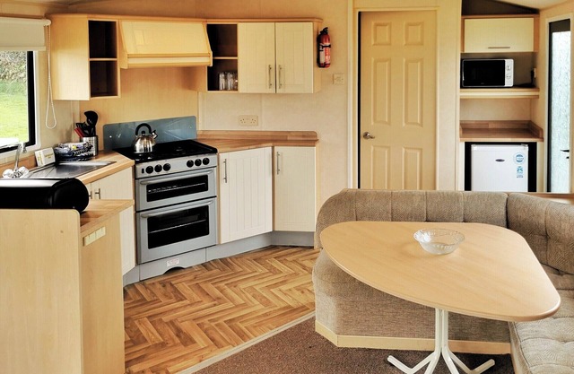 Spacious and comfortable 12ft-wide caravan with one double and two twin.