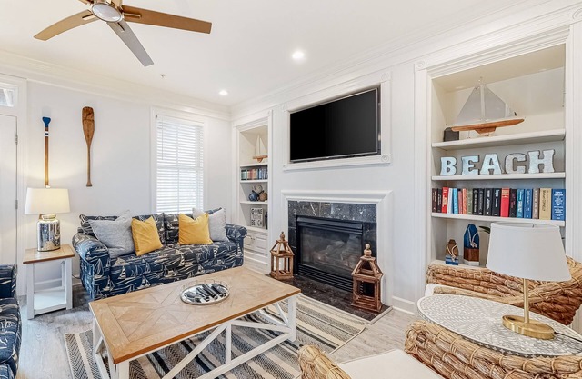 Spacious beachside home with fireplace, washer/dryer, pools, dock, & gym