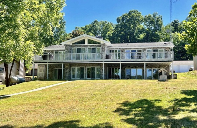 Spacious Lake house with Double Boat Dock & Gently Sloping Lot