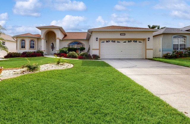 Spacious Lakefront Home with a Screened-In Pool in Exclusive Community