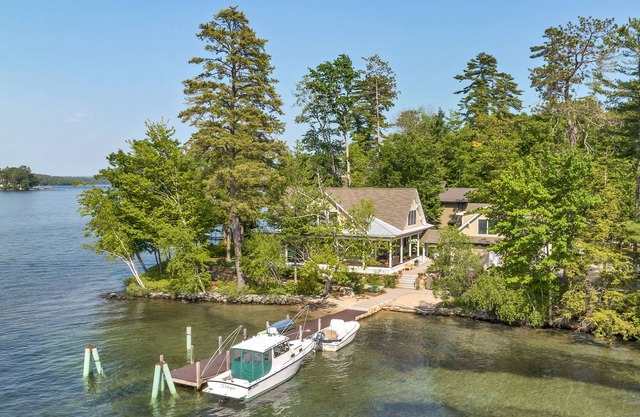 Spectacular Winnipesaukee Point Lot With Custom Home and Separate Guest Space