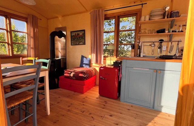 Spend the night in the circus wagon on the sheep pasture
