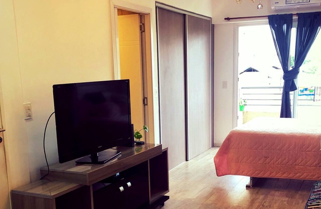 Studio apartment with garage and balcony overlooking the city