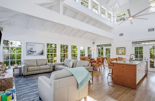 Stunning canal-front home with pools, AC, W/D & hammock