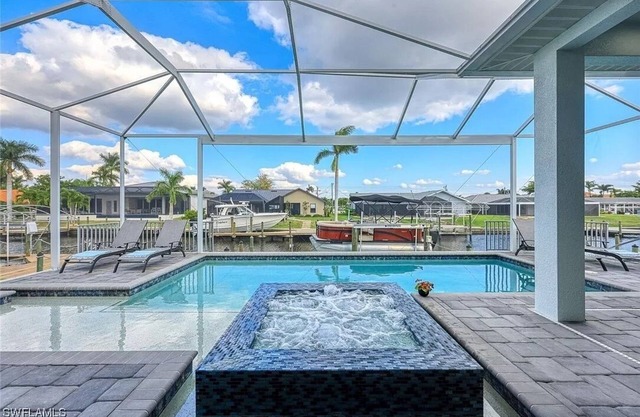 Stunning New Waterfront Luxury Villa with oversized Heated pool and Hot tub!
