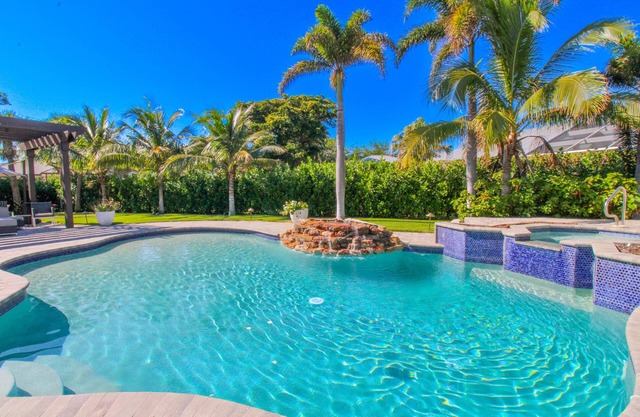 STUNNING TOP TO BOTTOM THIS 4 BED-5 BATH SINGLE FAMILY POOL AND SPA HOME