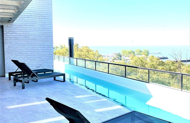 Stylish apartment by river with pool & grill