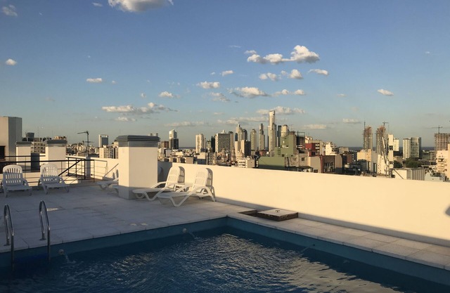 Stylish San Telmo apartment w/pool, gym & balcony—steps from iconic market!