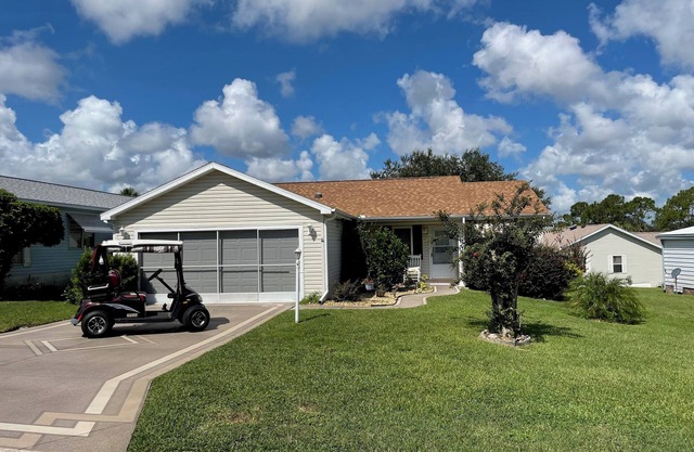Sunlit retreat overlooking championship fairways—your Florida oasis awaits!