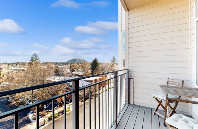 Sunny condo with open layout, smart TV, balcony, W/D, & AC - great location
