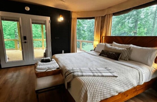 The Dogwood - Glamping tent with 1 King bed for 2 adults. En suite bathroom, kitchenette, and open porch.