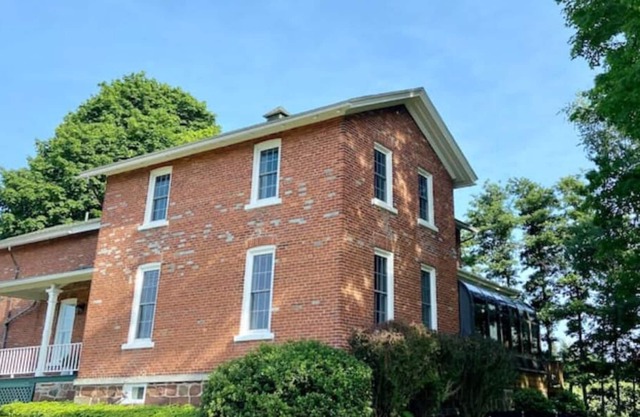 The farmhouse at Hagen Acres, nestled in apple orchards country
