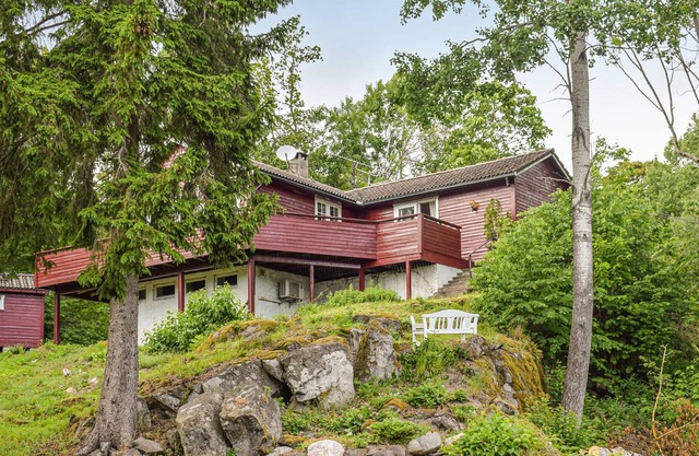 The hidden house in the forest- built on rocks, with large terrace and view of the lake.