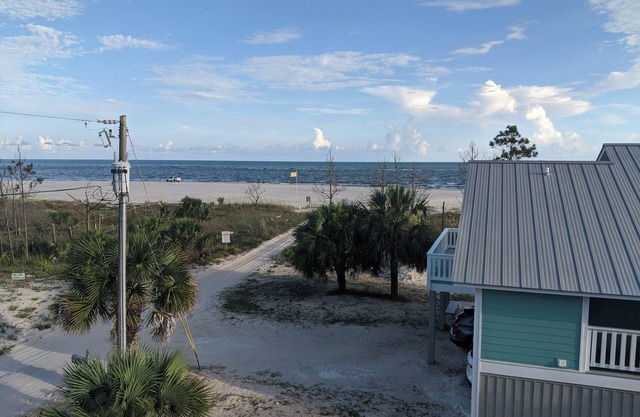 The Lucky Dog Beach House steps from the beach.