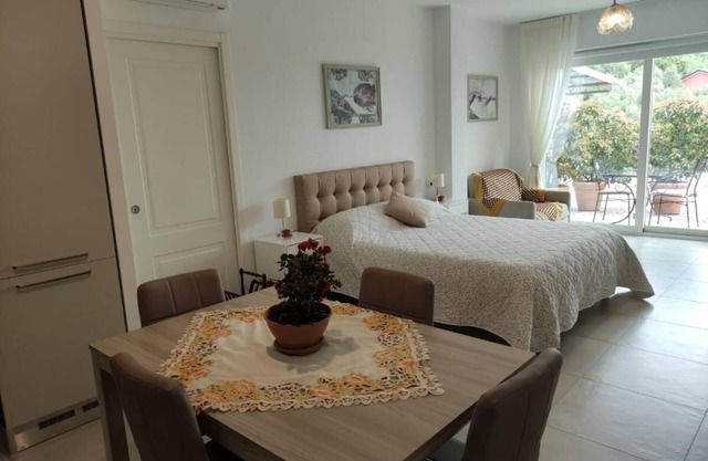 The olive house between hill and sea