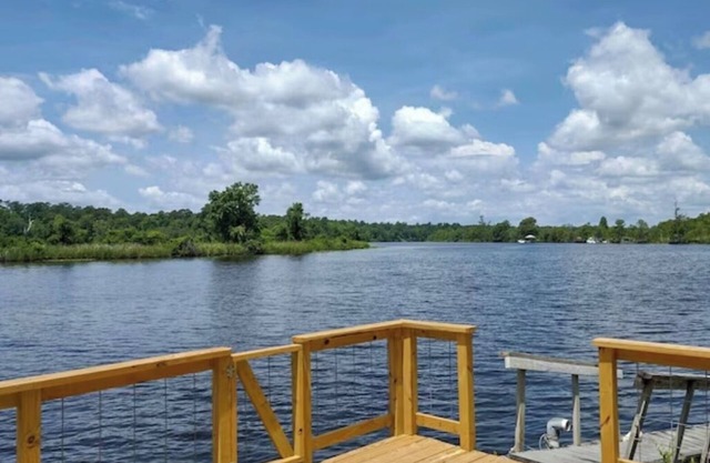 This beautiful 3-bedroom 2-bathroom Riverfront home is a great place to unwind.