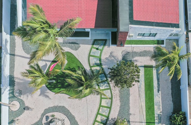 This beautiful 4-bedroom, 3-bathroom home is just a 2-minute walk from the crystal-clear ocean.