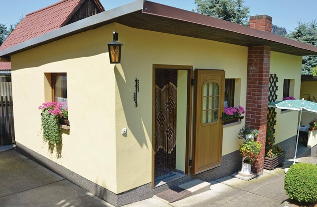 This cozy vacation home in the garden of a family house in Königstein stands high above the river va