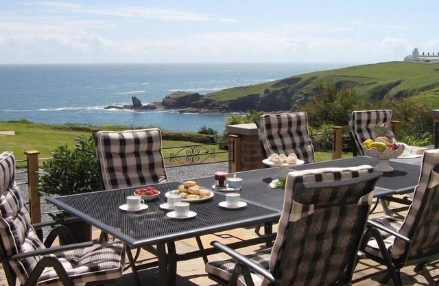 This fabulous Arts and Crafts villa sits in an acre of grounds on a front line cliff top
