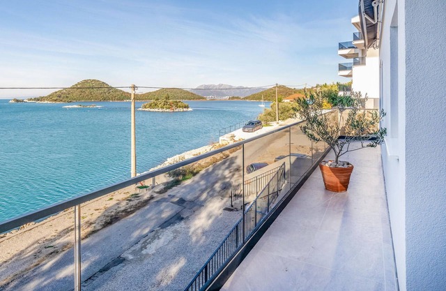 This modern and stylish vacation apartment welcomes you with a fantastic location by the sea.