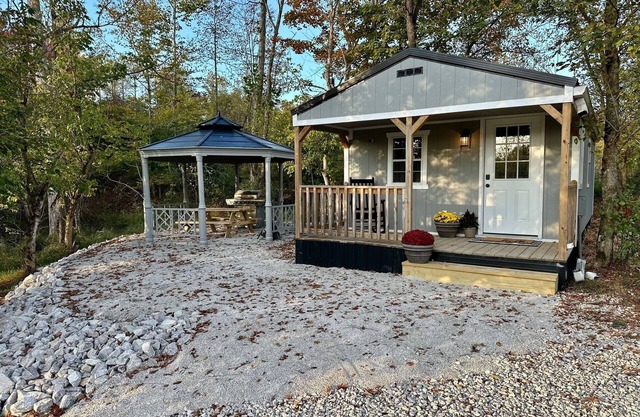 This tiny cabin is a peaceful place complete with stocked pond and kayaks!