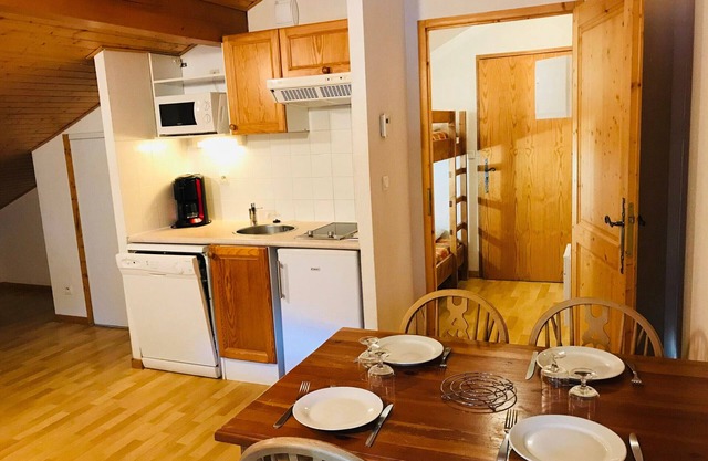 Top floor studio with pools, sauna, gym, parking, and mountain views in Samoëns