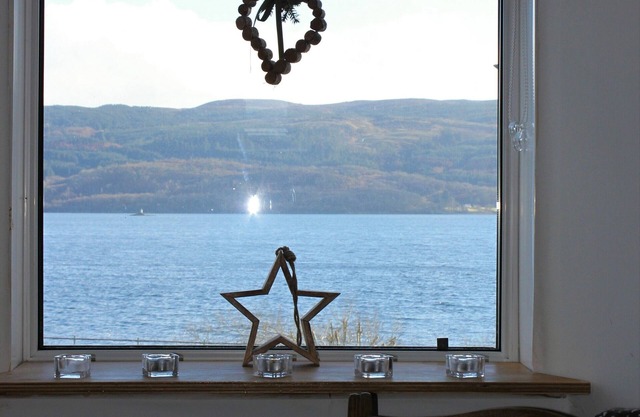 Traditional whitewashed fisherman's cottage overlooking Loch Fyne