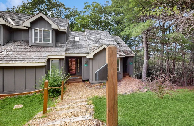 Treetop condo near golf + skiing with deck, grill, fireplace, & washer/dryer