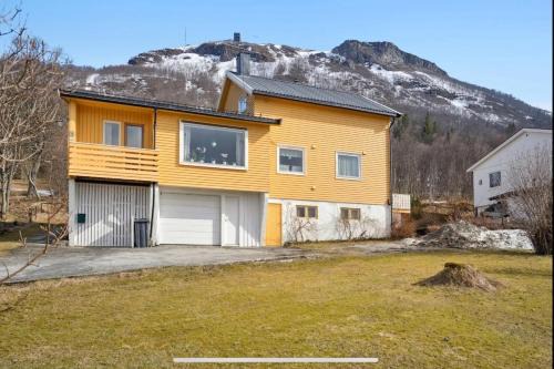 Tromsø pearl near mountains, city life and northern lights