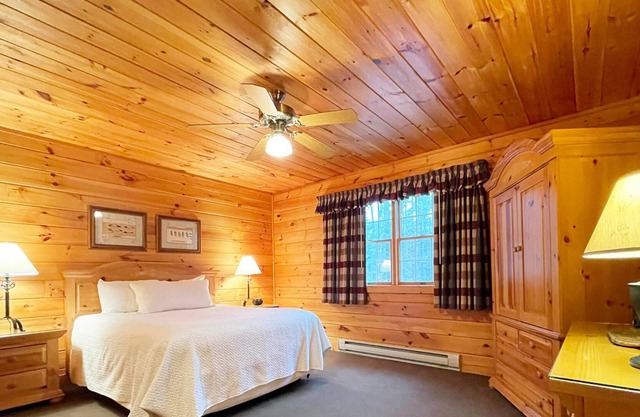 Two-bedroom, two-bath log cabin boasts an incredible lake view