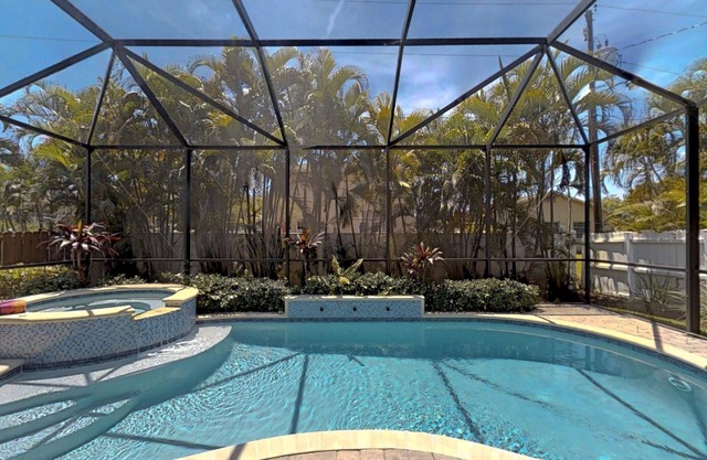 Two Master Bedrooms! Less than 1 Mile to the beach with heated pool and spa