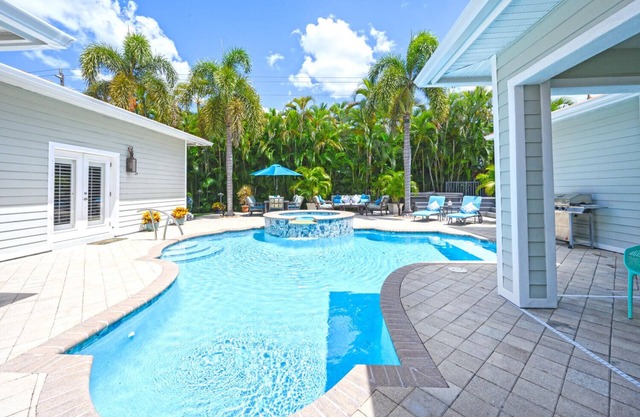 Unique Moorings home with personal gym, newly remodeled pool, 4 ensuite bedrooms