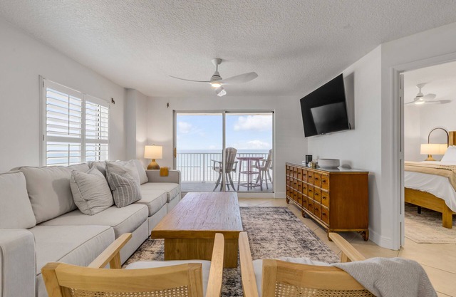 Updated direct oceanfront corner condo with stunning beach views, a heated pool, and parking garage