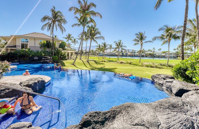 Updated ground-level condo with A/C, pool, & fitness center