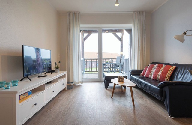 Vacation apartment Deichkieker. Close to the beach and with balcony.