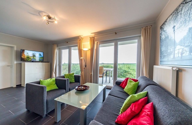 Vacation apartment by the North Sea with a great balcony by the water and its own sauna