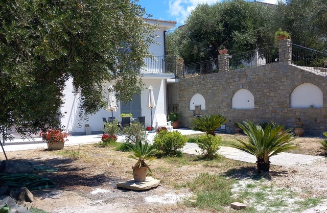 Villa between olive groves and the sea