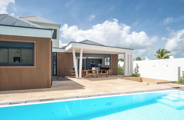 Villa Kassav beautiful garden aperitif area and mirror pool close to the beach
