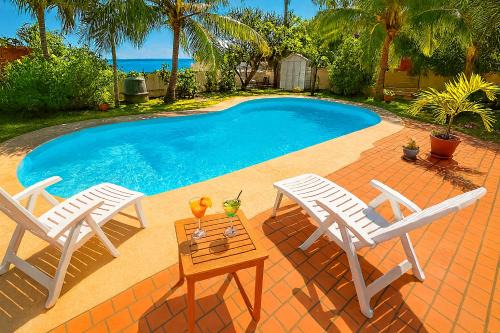 Villa O'rizon Bleu - Piscine XXL et vue mer panoramique sur St Gilles les Bains