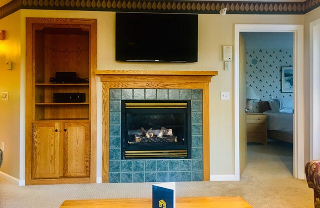 Walk to lifts condo with mountain view, heated pool, fireplace, & fitness room