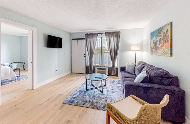 Water-view Marco Island condo with firepit, grill, dock & W/D access