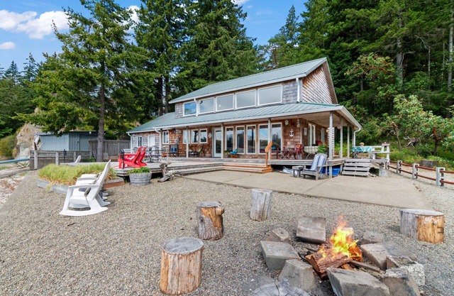 Waterfront, cabin- style home with breathtaking views of Skookum Inlet.
