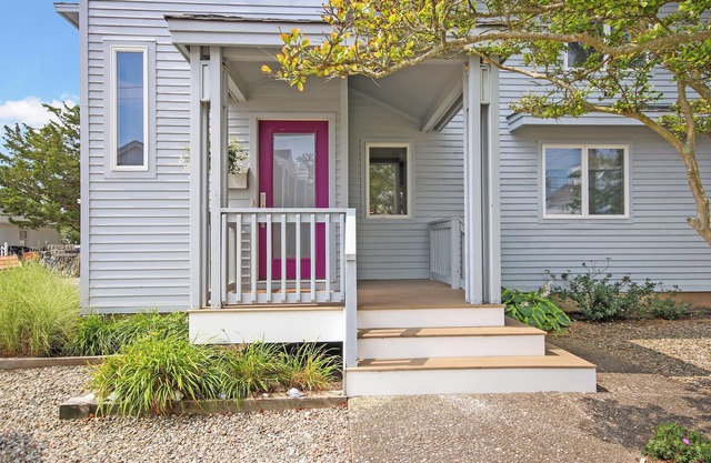Welcome to a stunning two-story, four-bedroom townhouse just two blocks from the beach
