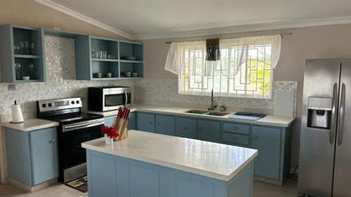 Welcome to Hope Winds, a charming property ranch-style house on a seren