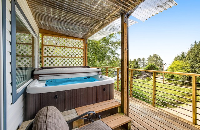 Welcoming Condo with Ocean Views and Private Hot Tub - Short Walk to the Beach