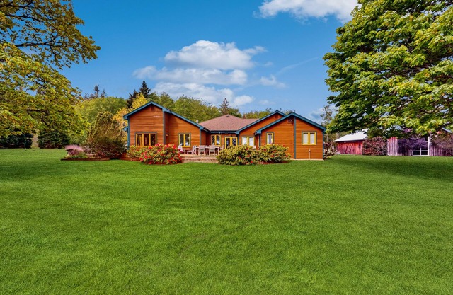 Whidbey Island waterfront acreage with gardens, pond, chef's kitchen, & studio