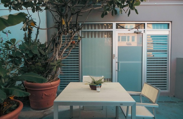 Within a tropical garden and outdoor seating, for short/long term travel