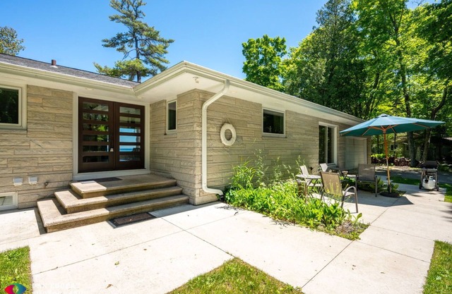 You’ll find this unique Lake Michigan beachfront getaway on scenic Glidden Dr.