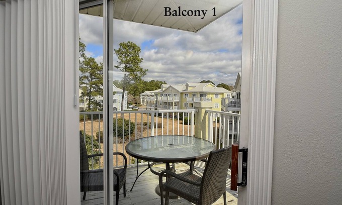 Calabash Condo | 1,180 sqft - Modern Villa with palm trees